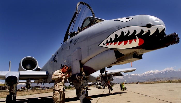 Staff Sergeant Keith Haas of the US Air Force adjusts equipment on an A-10 Warthog warplane at Bagram Air Base, north of Kabul April 17, 2002. — Reuters