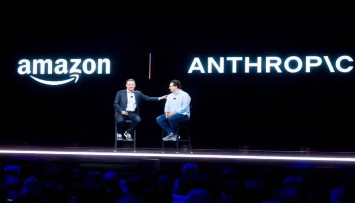 Adam Selipsky, then CEO of Amazon Web Services, speaking with Anthropic CEO and co-founder Dario Amodei at a conference. — AFP