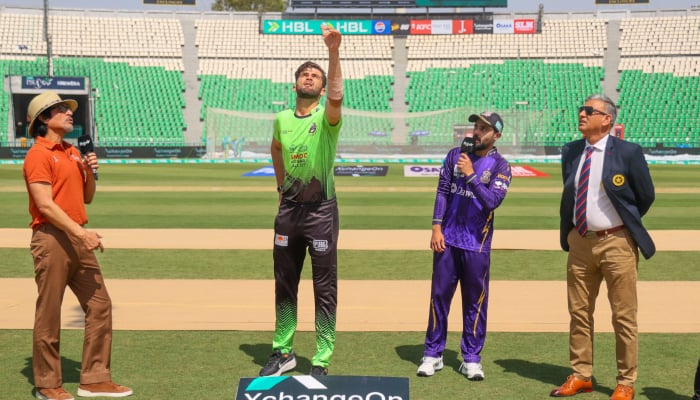 Lahore Qalandars captain Shaheen Afridi (second left) and his Quetta Gladiators counterpart Saud Shakeel (second right) are present for the toss in the PSL match at Gaddafi Stadium in Lahore on April 21, 2026. — PCB