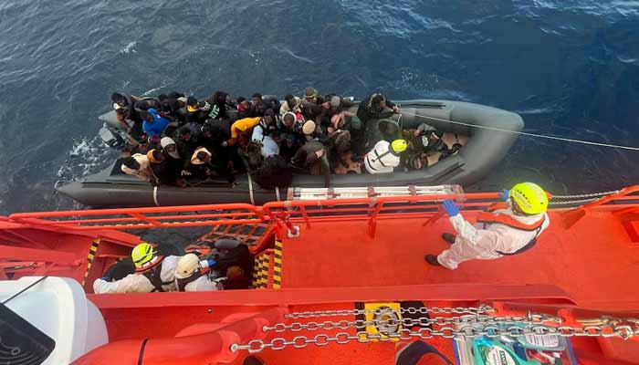 Spanish coast guards wearing white suits work on a rescue operation as they tow a rubber boat carrying migrants, including a newborn baby, off the island off the Canary Island of Lanzarote, in Spain, in this handout picture obtained on January 8, 2025.— Reuters/File
