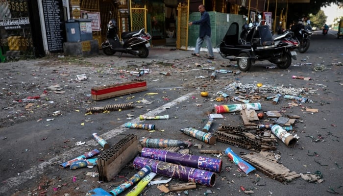 Used firecrackers litter the street after a celebration of Diwali, in Ahmedabad, India. — Reuters/File