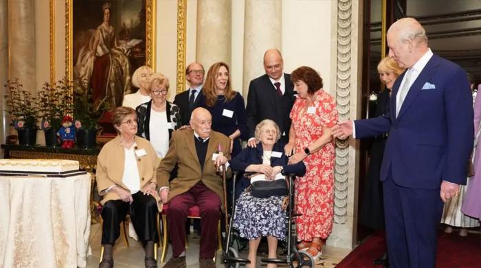 King Charles leads birthday cheers inside the Palace's vibrant tribute