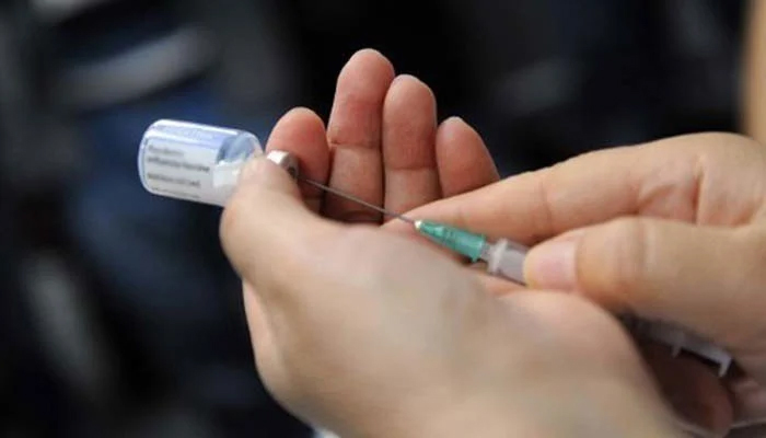 A health worker fills a disposable injection with a medicine.— AFP/File