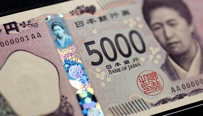 Holograms, which show different images and colours depending on the angle at which they are viewed, are seen on the Japanese 5,000 yen banknote as the note is displayed at a currency museum of the Bank of Japan, on the day the new notes of 10,000 yen, 5,000 yen and 1,000 yen went into circulation, in Tokyo, Japan, July 3, 2024. — Reuters