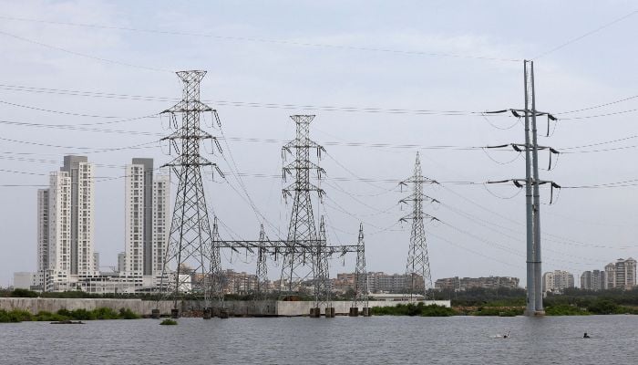 Power transmission towers are pictured in Karachi, July 26, 2022. — Reuters