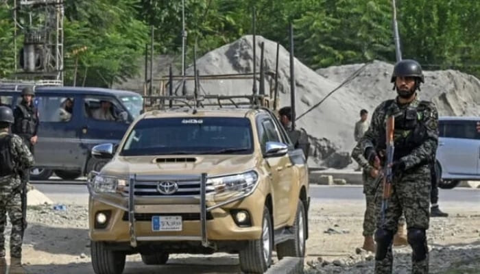 Security personnel stand guard in Bajaur district of Khyber Pakhtunkhwa. — AFP/File
