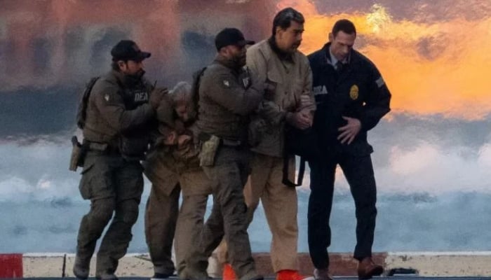 Captured former Venezuelan president Nicolas Maduro and his wife Cilia Flores are escorted, as they head towards the Daniel Patrick Moynihan United States Courthouse in Manhattan, at Downtown Manhattan Heliport, in New York City, US, January 5, 2026. — Reuters