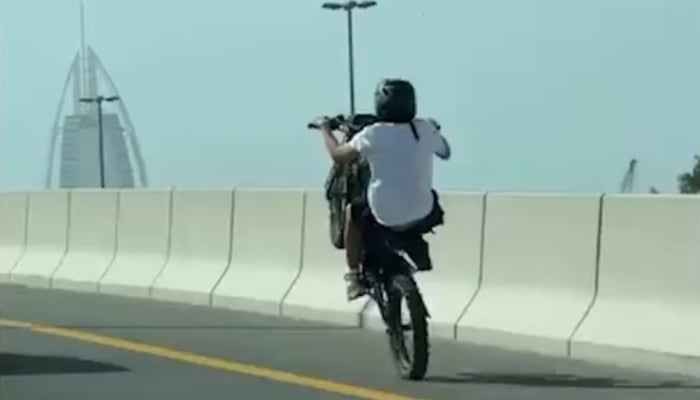 A biker performs dangerous stunts on public roads in Dubai in this screenshot from a video released on April 24, 2026. — Screengrab via X @DubaiPoliceHQ