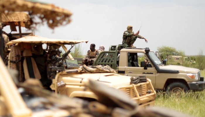 Malian soldiers are pictured during a patrol with soldiers from the new Takuba force near the Niger border in Dansongo Circle, Mali, August 23, 2021. — Reuters