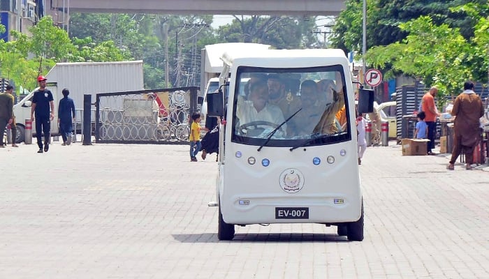 A family ridding electric shuttle service at Saddar area in Rawalpindi, September 14, 2026. — Online
