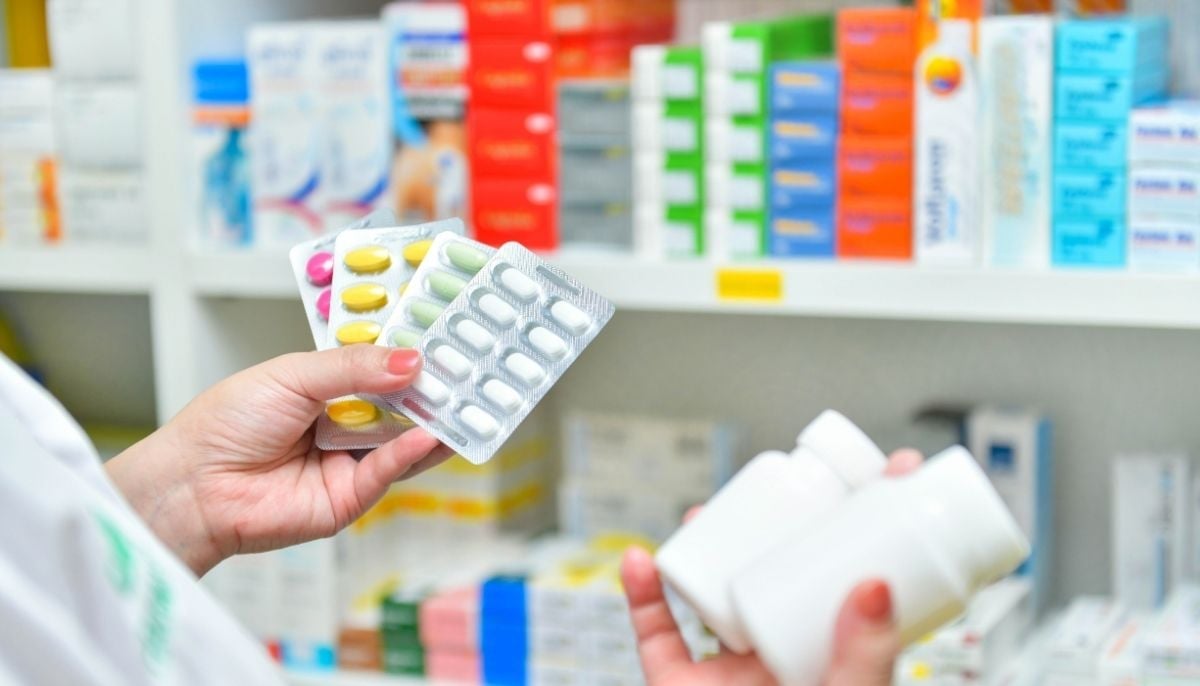 A representational image of a person checking medicines. — Canva