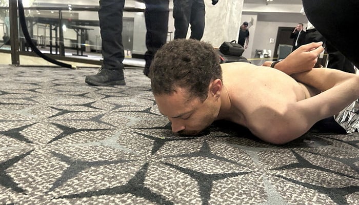 Law enforcement personnel detain Cole Tomas Allen, a suspect in the shooting incident at the White House Correspondents Association dinner, in Washington, DC, US April 25, 2026. — Reuters