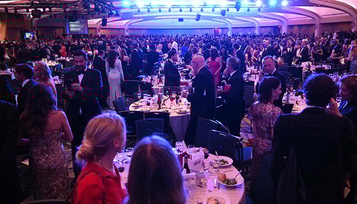Attendees are seen inside the ballroom after shots were reportedly fired during the White House Correspondents dinner at the Washington Hilton in Washington, DC, on April 25, 2026. — AFP