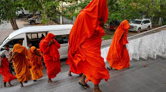 How did 22 Buddhist monks get caught smuggling 242 pounds of Cannabis?