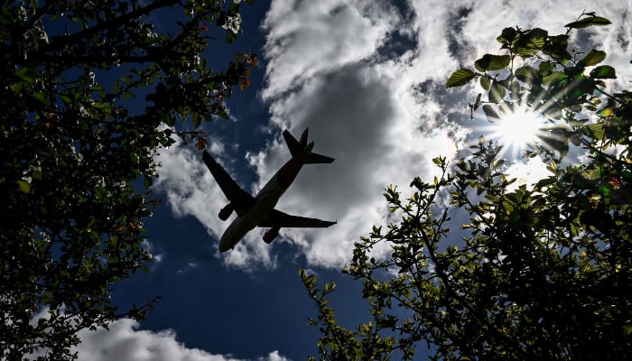 A passanger jet prepares to land at London Gatwick Airport, near Crawley, southern England, on April 20, 2026. — AFP
