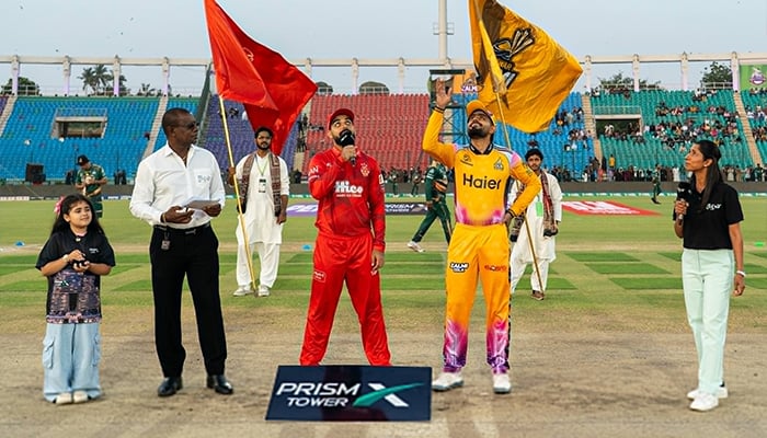 Peshawar Zalmi skipper Babar Azam (centre-right) flips the coin while Islamabad United captain Shadab Khan (centre) makes the call during the toss for the PSL 11 Qualifier at National Bank Stadium, Karachi, on April 28, 2026. — PSL
