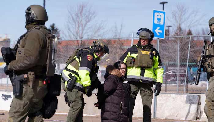 Local law enforcement detains a protester after declaring an unlawful assembly during a demonstration against ongoing Immigration and Customs Enforcement (ICE) operations outside the Whipple Federal Building, in Fort Snelling, Minnesota, US, March 1, 2026. — Reuters/File