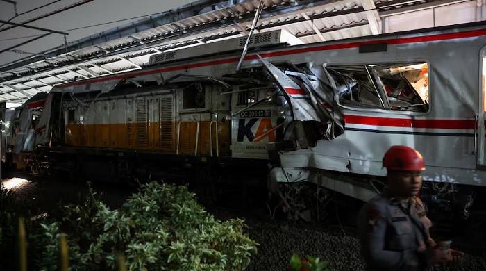 Indonesia train crash toll rises to 14 as rescuers work to remove trapped passengers