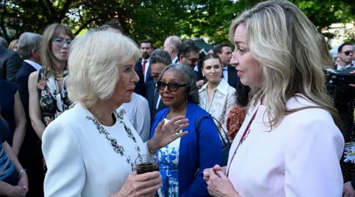 Queen Camilla uses garden party to champion women's safety