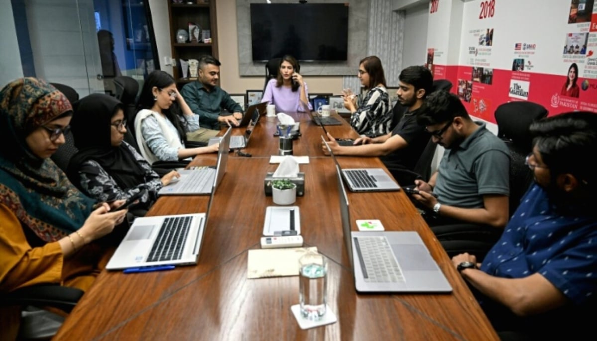 Sara Saeed Khurram, a doctor and chief executive officer of digital health firm Sehat Kahani, conducting a meeting with her employees in Karachi in this undated image. — AFP