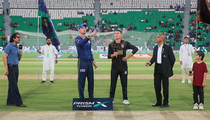 Multan Sultans skipper Ashton Turner (centre-left) flips the coin and Hyderabad Kingsmen captain Marnus Labuschagne (centre) makes the call during the toss for the PSL 11s first eliminator at Gaddafi Stadium, Lahore, on April 29, 2026. — PSL