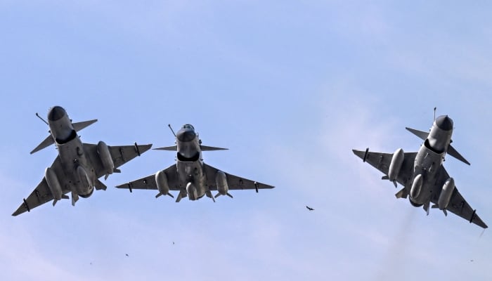 PAF J-10 fighter jets fly past over the President´s House during the national day parade in Islamabad on March 23, 2025. — AFP