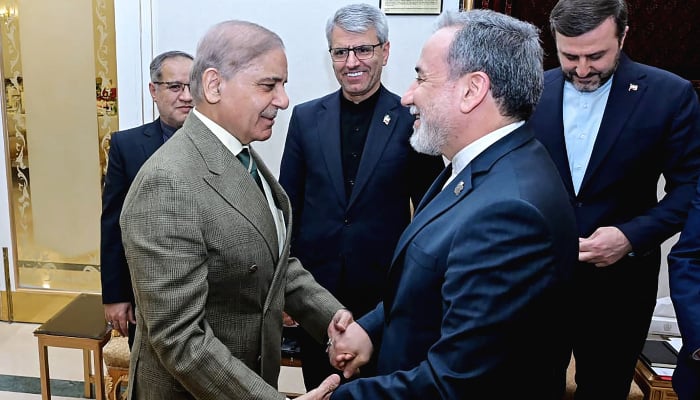 This handout photograph taken on April 25, 2026 and released by Pakistans Prime Minister Office shows Prime Minister Shehbaz Sharif (L) greeting Irans Foreign Minister Abbas Araghchi (2R) before their meeting amid the Middle East war, at the Prime Minister House in Islamabad. — AFP