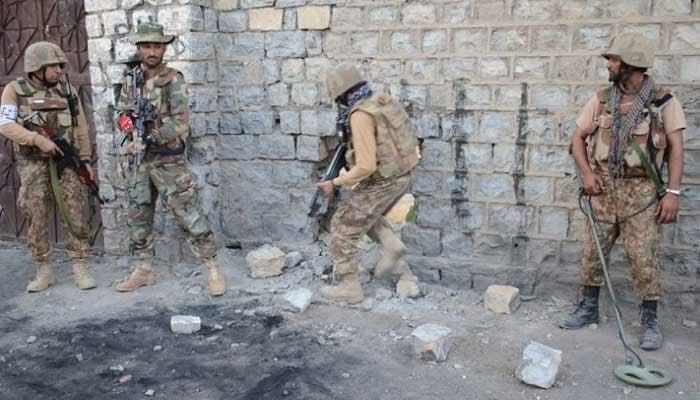 This file photo shows security forces taking position during an operation. — ISPR/File