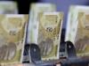 Indian rupee hits record low, puts central bank on defensive amid inflation fears