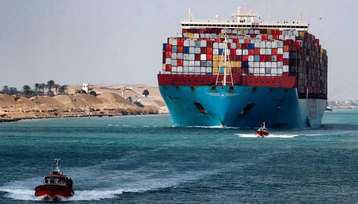 A shipping container passes through the Suez Canal in Suez, Egypt February 15, 2022. — Reuters