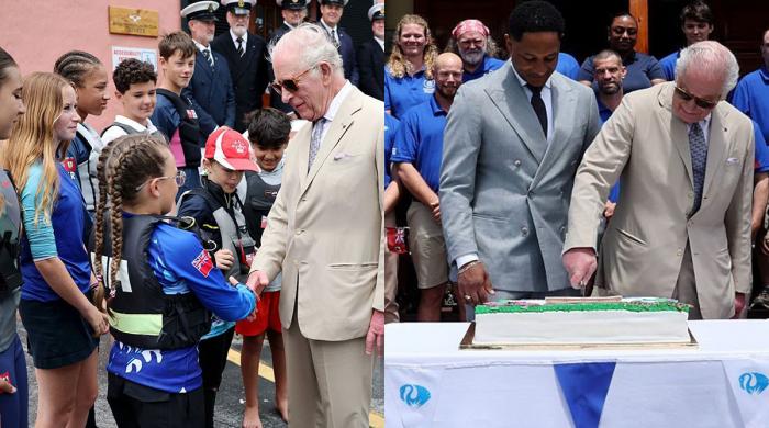 Charles celebrates big day in with cake, trees, and 'living classroom' tour