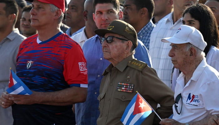 Cubas President Miguel Diaz-Canel (L), former President Raul Castro (C) and former Vice President Jose Ramon Machado Ventura (R) attend a May Day rally marking International Workers Day in Havana, Cuba, on May 1, 2026. — AFP