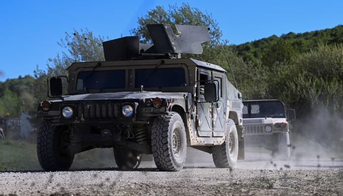 Military vehicles drive during the US Army Combined Resolve exercise at the US Armys southern Germany training facilities in Hohenfels, Germany, April 30, 2026. — Reuters