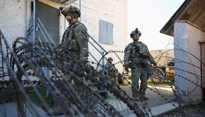 Soldiers stand next to a razor wire at a media day during the US Army Combined Resolve exercise at the US Armys southern Germany training facilities in Hohenfels, Germany, April 30, 2026. — Reuters