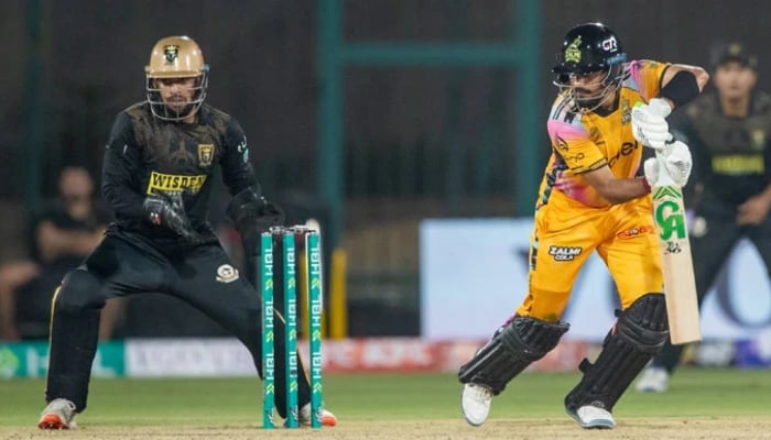 Peshawar Zalmis Babar Azam (right) watches the ball after playing a shot during their PSL 11 match against Hyderabad Kingsmen at the National Bank Stadium in Karachi, April 8, 2026. — PSL