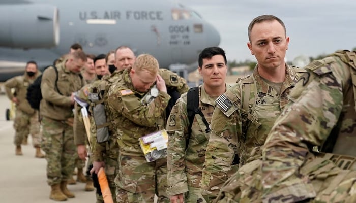 Military personnel from the 82nd Airborne Division and 18th Airborne Corps board a C-17 transport plane for deployment to Eastern Europe, amid escalating tensions between Ukraine and Russia, at Fort Bragg, North Carolina, US, February 3, 2022. — Reuters