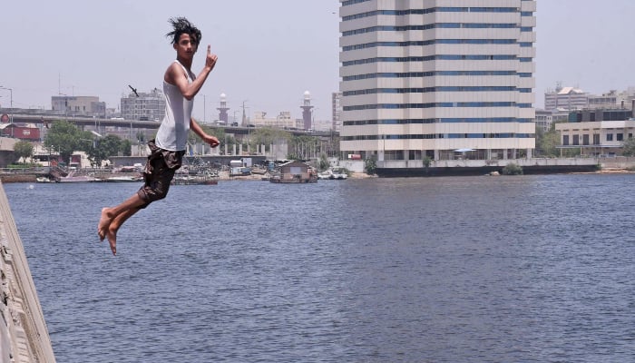 A youngster jumps into Arabian Sea water during a hot summer day in Karachi, May 2, 2026. — Online