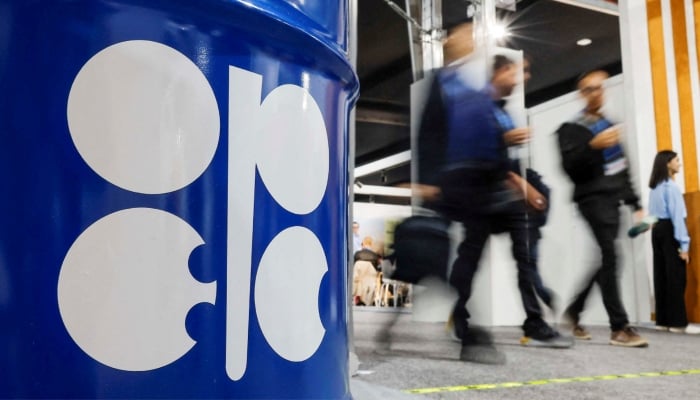 People walk past an installation depicting barrel of oil with the logo of Opec during the COP29 United Nations climate change conference in Baku, Azerbaijan. — Reuters/File