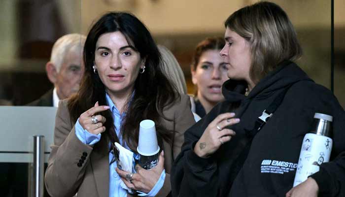 Gianinna Maradona (Left), daughter of Argentine football legend Diego Maradona, leaves the court hall for a trial hearing on her father’s death in San Isidro, Buenos Aires province, Argentina on April 21, 2026. — AFP