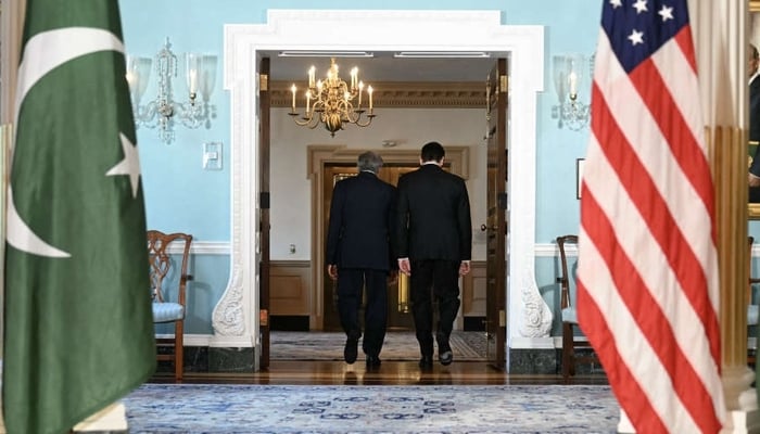 A representational image of Pakistani and US flags displayed as DPM Dar and Secretary of State Marco Rubio walk through a door during a meeting.  — AFP