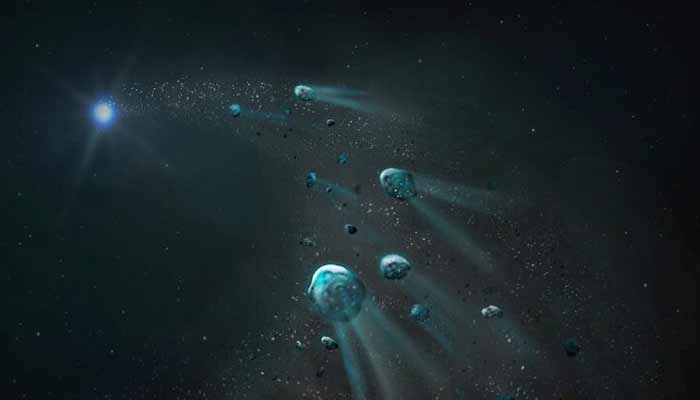 An early stage of an icy body being torn apart by the intense gravity of a white dwarf -a highly compact stellar ember- leaving glowing trails of gas and dust, as its fragments spiral inward, is seen in this handout illustration released on September 24, 2025.— Reuters/File