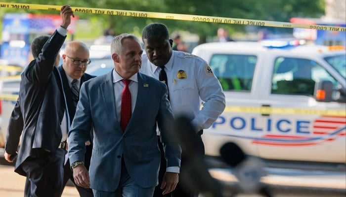 Matthew Quinn, Deputy Director of the US Secret Service, walks to speak to the media at the scene of an officer-involved shooting in Washington, DC, US, May 4, 2026.
