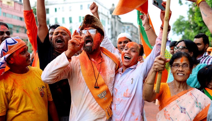Indias ruling Bharatiya Janata Party (BJP) supporters celebrate their party leading in the West Bengal state assembly elections, outside the partys regional office in Kolkata, India, May 4, 2026. — Reuters