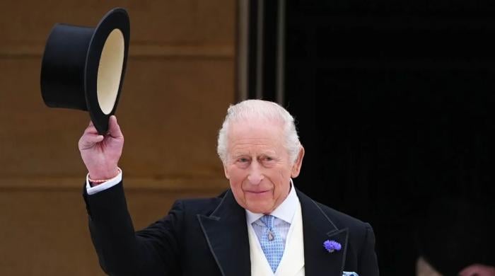 King Charles meets someone special at garden party