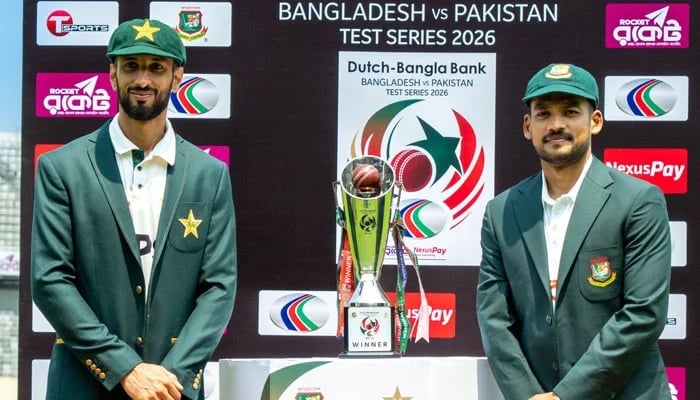 Pakistan captain Shan Masood (left) and Bangladeshs Najmul Hossain Shanto pose with the trophy for their upcoming Test series at the Sher-e-Bangla National Cricket Stadium in Mirpur on May 7, 2026. — X/@TheRealPCB