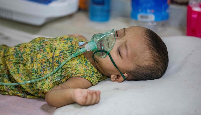A child diagnosed with measles receives treatment inside a paediatric ward at the Bangladesh Shishu Hospital and Institute in Dhaka on May 6, 2026.