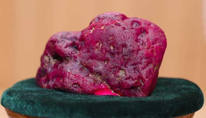 This handout photo taken and released on May 7, 2026 by Myanmar Radio and Television (MRTV) shows an 11,000-carat ruby in Naypyidaw, after it was found at a gem tract in Mogok in Mandalay Region. — AFP