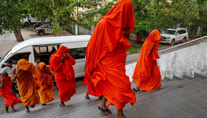 Sri Lankan monks arrive to appear before a court after their arrest in Negombo on April 26, 2026. — AFP
