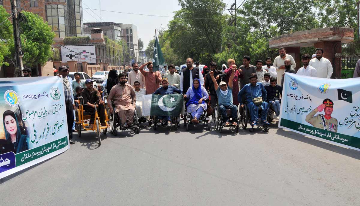 Persons with disabilities under the banner of the Society for Special Persons participate in a rally to commemorate Marka-e-Haq and express solidarity with the Pakistan Armed Forces in Multan. — APP