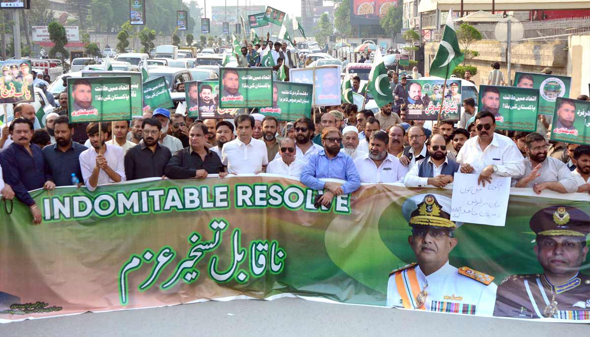 Traders hold a rally to commemorate the first anniversary of Marka-e-Haq at Mall road. — Online